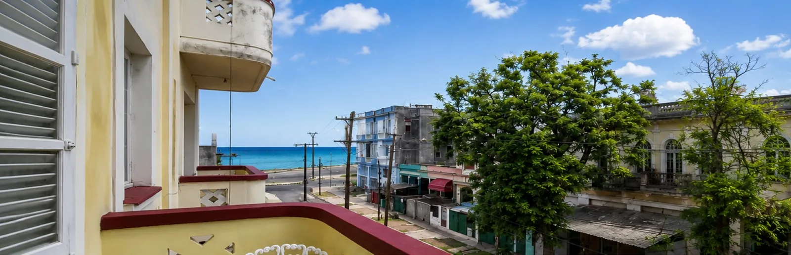 Balcony of a Vedado apartment overlooking the street and the sea