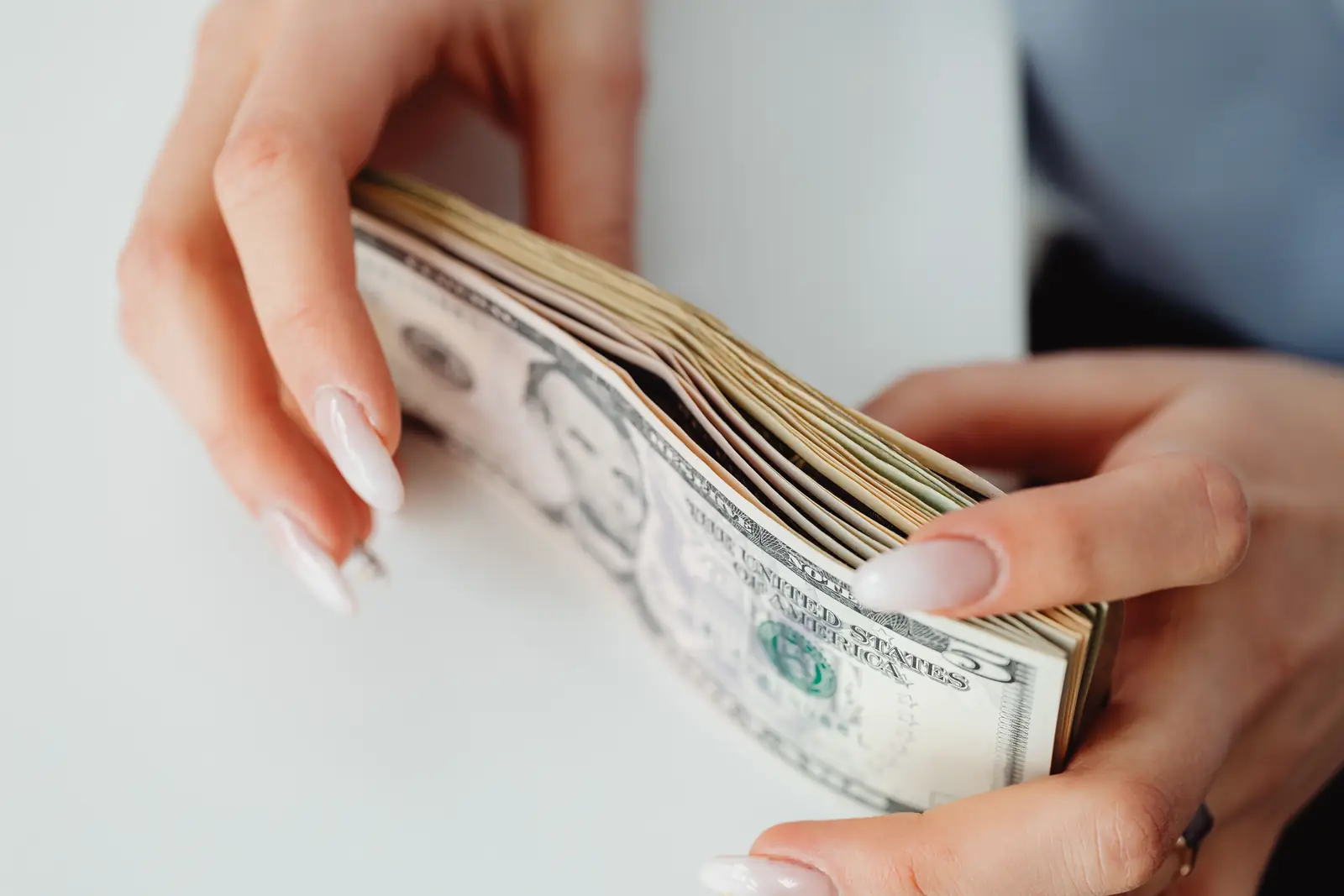 Hands counting cash banknotes