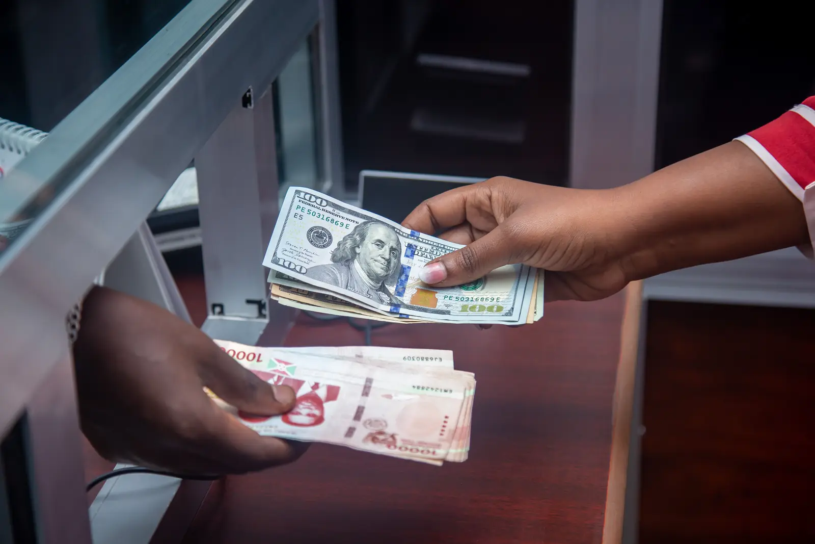Currency exchange at an office counter