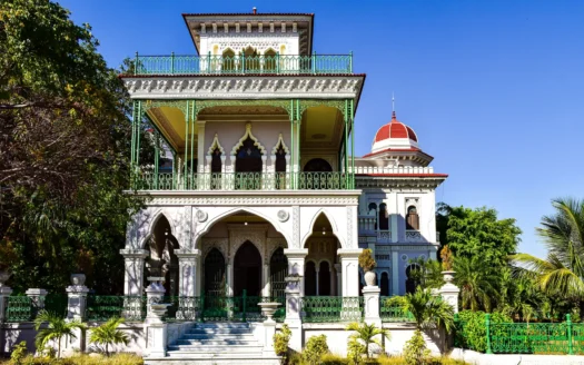 Facade of a Cuban colonial house with wrought iron grilles